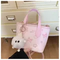 Pink chic printed bucket bag with cartoon graphics and a white fluffy charm - With Pendant Style / Pink