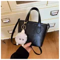 Black embossed bucket bag with floral patterns and a cute white plush charm - With Pendant Style / Black