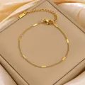 Golden titanium steel chain bracelet with flat oval charms on silk padding - Gold Flat Snake Chain Bracelet