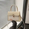 Chic beige textured crossbody bag with horsebit metal buckle and top handle for women - Off White