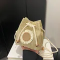 Beige straw bucket bag with daisy flower decor and drawstring closure for summer beach - Flower Khaki
