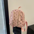 Pink mini backpack with cartoon bear prints and gold zippers for a stylish daily look - Pink