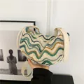 Chic knit underarm bag in creamy white with blue and green wave embroidery pattern - Wavy White