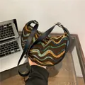Knitted crescent underarm bag with colorful wave patterns and black leather straps - Wavy Coffee