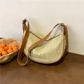 Woven half-moon hobo bag with brown leather trim and straw herringbone texture - Khaki