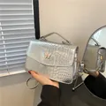 Silver metallic butterfly shoulder bag with crocodile embossed texture and handle - Silver