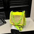 Neon green woven straw crossbody bag with cream body and acrylic chain handle - Yellow