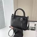 Minimalist black pebbled leather square crossbody bag with top handles and fashion logo - Basic Style / Black