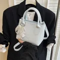Chic light blue crossbody bag with lychee texture and elegant pearl bow charm - With Pearl Lace Pendant / Blue