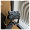 Chic black quilted crossbody bag with stylish patterned wide shoulder strap - Black