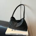 Classic black woven leather hobo bag with checkered texture and shoulder strap - Black