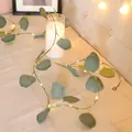 Artificial eucalyptus vine LED string lights with warm white glow for home decor - Eucalyptus Rattan Light Style