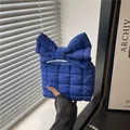 Quilted bow handbag in Klein Blue finish featuring a soft puffer texture for women - Blue