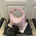 Pink pleated handbag with textured patterns and adjustable strap for women fashion - Pink