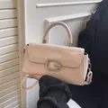Pale pink faux leather crossbody bag with a sparkling G-letter buckle and top handle - Pink