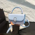 Light blue patchwork handbag with premium leather flap and silver metal buckle closure - Blue