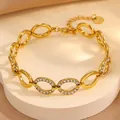 Bracelet doré en acier titane avec maillons ovales et pavé de strass en trèfle brillant - Style Oval Incrusté de Strass / Or