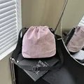 Lightweight lavender nylon drawstring bucket bag with adjustable black shoulder strap - Pink