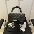Minimalist black quilted PU leather crossbody bag with ruffled handle and gold hardware - Black
