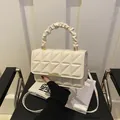 Chic beige quilted square crossbody bag with ruched handle and gold metal clasp - White