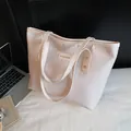 Large capacity off-white tote bag with embossed geometric patterns and fashion label - White