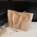 Minimalist beige large capacity tote bag with letter embossing and golden hardware detail - Khaki