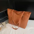 Caramel brown large capacity tote bag with embossed texture and fashion label - Brown