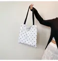 White canvas tote bag with black floral polka dots and delicate white lace trim detail - Small Floral Cream
