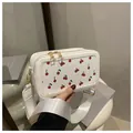 White crossbody square bag with red cherry prints and wide shoulder strap - White