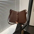 Minimalist dark brown matte leather shoulder bag with golden buckle and adjustable strap - Brown