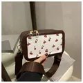 Brown crossbody bag with cherry print, wide nylon strap and double zipper closure - Brown