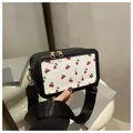 Black and white crossbody bag with cherry print and wide nylon strap - Black