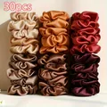 30-piece set of premium satin scrunchies in various rich earthy tones for hair styling - Brown