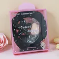 Fascia in velluto nero molletta a fiore e spugna trucco in confezione rosa - Nero (Motivo Frangipane)