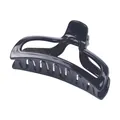 Close-up of a glossy black geometric hair claw clip for thick hair styling on white background - Clear / Black