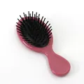 Mini tragbare pinke Haarbürste mit schwarzem Luftkissen und ergonomischem Massagegriff - Glänzend Karmesinrot