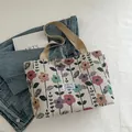 Large floral canvas tote bag with colorful vintage flower patterns and beige shoulder strap - Beige