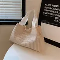 Beige woven tote bag with wide white fabric straps on a minimalist table setting - White Straps(5979952362090) / Off White