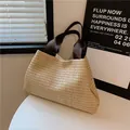 Large beige woven straw tote bag with dark brown canvas handles on a white table - Brown Straps(5979952362093) / Khaki