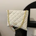 Chic white quilted tote bag with chunky gold chain strap and stylish FASHION label - White