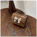 Brown mini crossbody bag with silver bow buckle and elegant metal chain strap - Brown