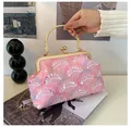 Detail of pink sequin evening bag with gold floral handle and delicate chain strap - Pink