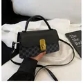 Bolso bandolera negro con estampado de monograma M y cierre dorado sobre seda - Negro