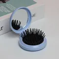 Brosse à cheveux pliable bleu clair avec miroir intégré et coussin de massage, voyage - Coque Bleue Coussin Noir Poils Noirs