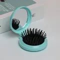 Brosse à cheveux pliable avec miroir de maquillage en bleu pastel portable - Coque Verte Coussin Noir Poils Noirs
