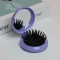 Brosse à cheveux pliante violette avec miroir intégré et coussin d'air massant - Coque Violette Coussin Noir Poils Noirs