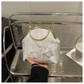 Detail of white lace embroidery handbag with floral butterfly patterns and gold metal clasp - White