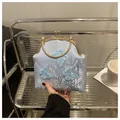 Detail of light blue floral jacquard bag with butterfly embroidery and golden hardware - Blue
