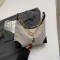 Beige woven tote bag with black leather accents and gold chain straps for daily commute - Khaki & Black