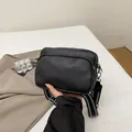 Black litchi pattern leather crossbody bag with stylish wide striped fabric strap - Black